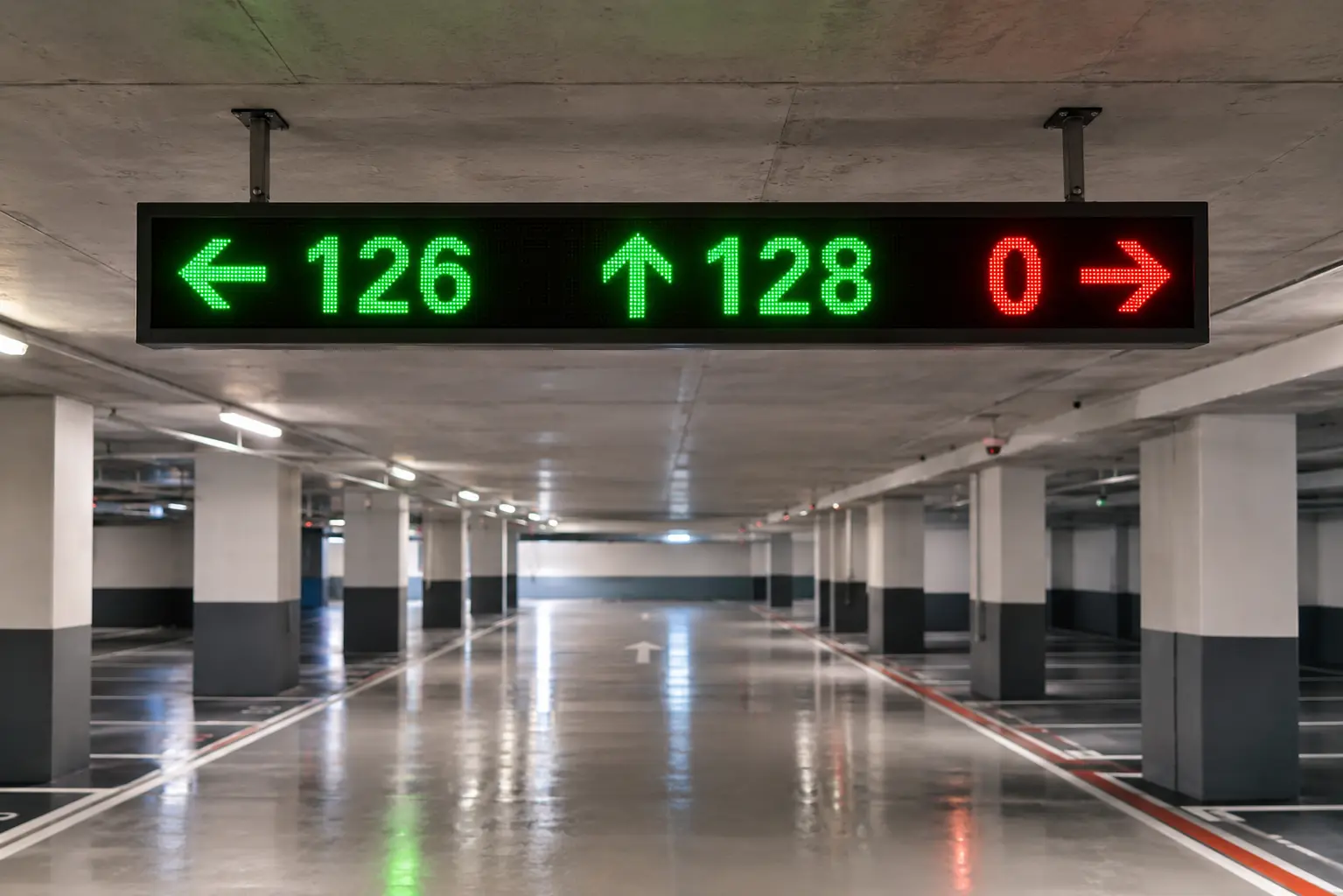 IoTize IoT Indoor LED Signage Display, a full-color LED parking guidance sign showing counts and arrows